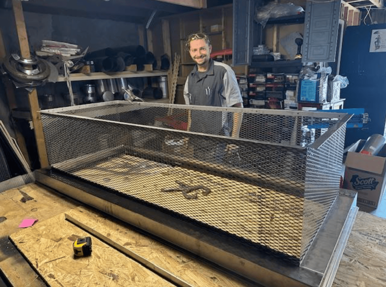 Custom chimney caps in metal shop